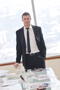 young business man alone in conference room photo