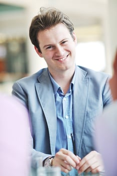 young business man alone in conference room photo