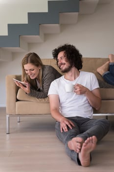 couple relaxing at  home with tablet computers photo
