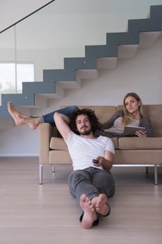 young couple relaxes in the living room photo