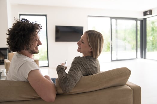 Rear view of couple watching television photo