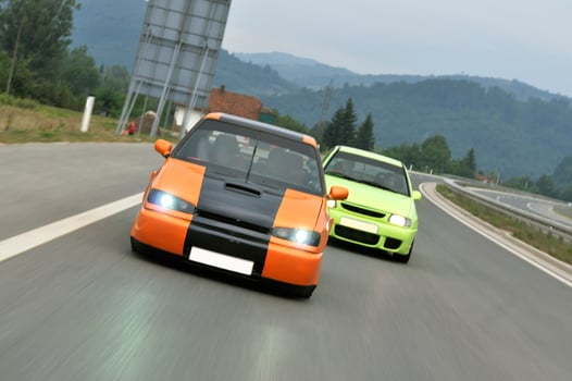 Tuning cars sacing down the highway photo