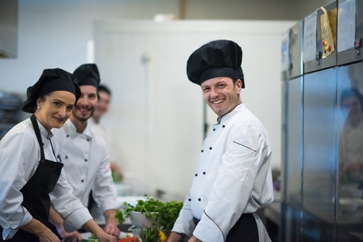 team cooks and chefs preparing meals photo