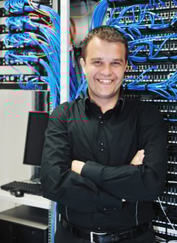 young it engeneer in datacenter server room photo