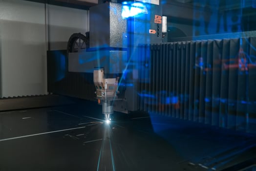 Turkey, 2022 - Sparks fly out machine head for metal processing laser metal on metallurgical plant background. Manufacturing finished parts for automotive production concept photo