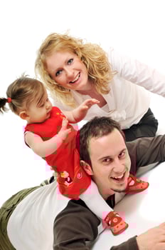 happy young family together in studio photo