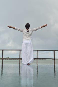 young woman relax on cloudy summer day photo