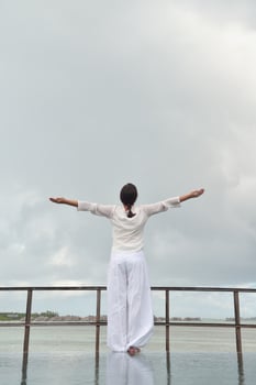 young woman relax on cloudy summer day photo