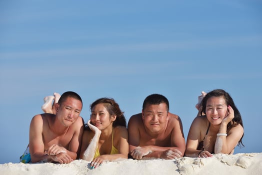 group of happy young people have fun on bach photo