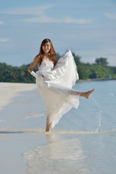 asian bride on beach photo