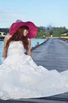 asian bride on beach photo