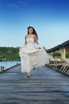 asian bride on beach photo