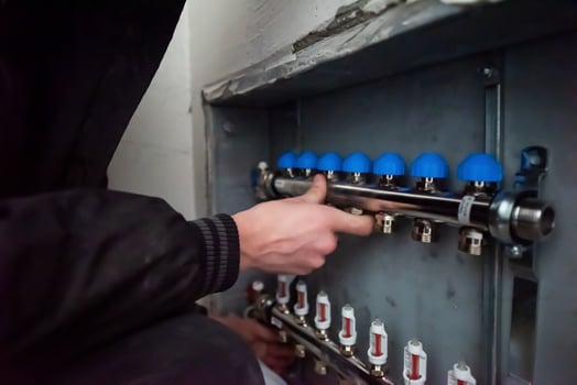 engineer checking technical data of heating system photo