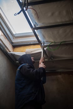 roofer man installing thermal insulation layer photo