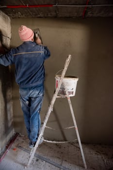 Worker plastering the wall by concrete photo