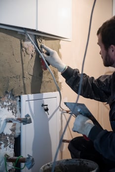 Worker plastering the wall by concrete photo