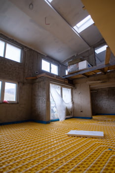 yellow underfloor heating installation with white pipes photo