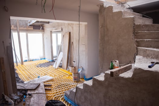 yellow underfloor heating installation with white pipes photo