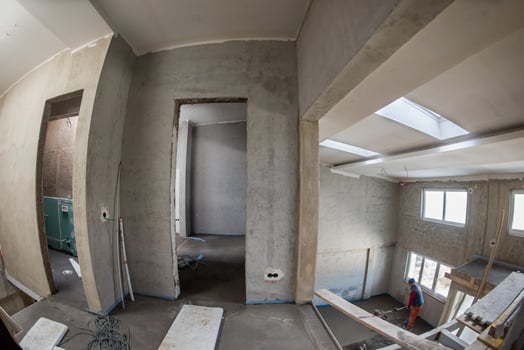 worker performing and polishing sand and cement screed floor photo