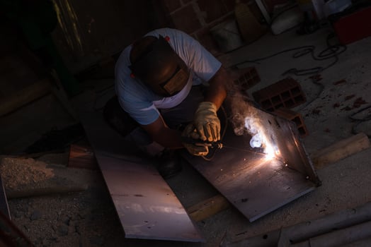 welder with protective mask welding steel photo