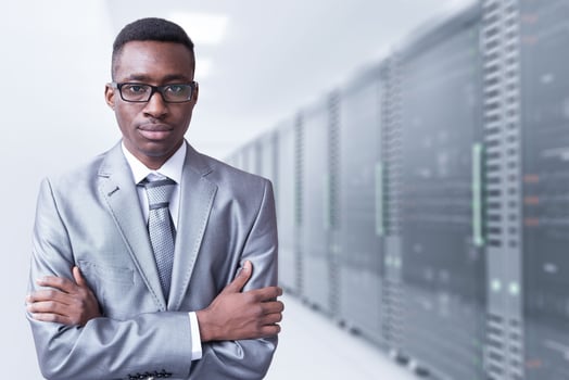Young man in server room photo
