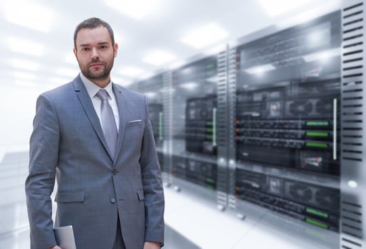 Young businessman in server room photo