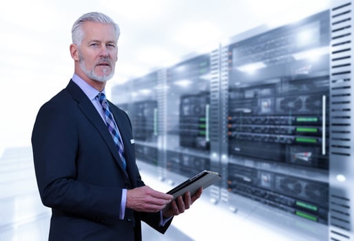 Senior businessman in server room photo