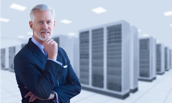 Senior businessman in server room photo