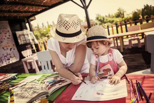 mom and little daughter drawing a colorful pictures photo
