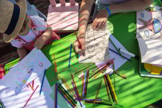 mom and little daughter drawing a colorful pictures photo