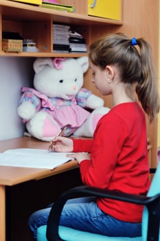 girl doing homework photo