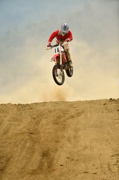 Riding a motocross bike photo
