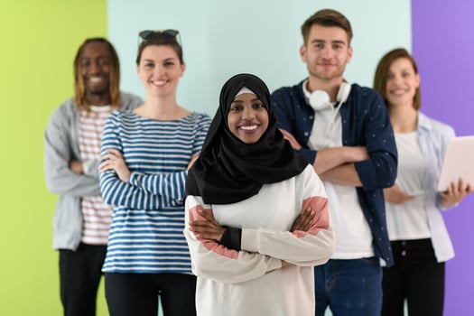 group of diverse teenagers posing in a studio, determined teenagers in diverse clothing. photo