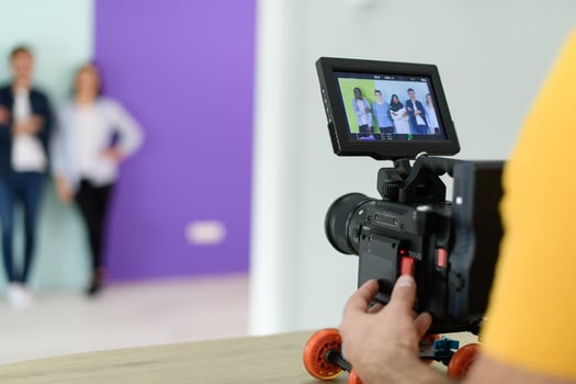 cameraman with professional equipment shoots video clips photo