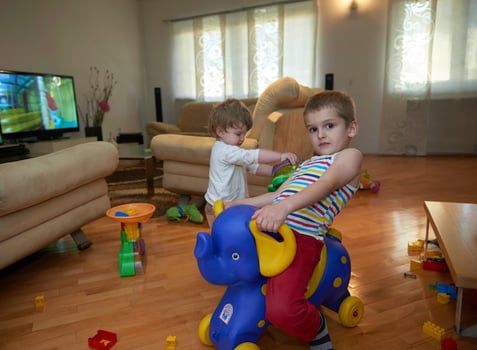 Little child playing  with sister at home photo