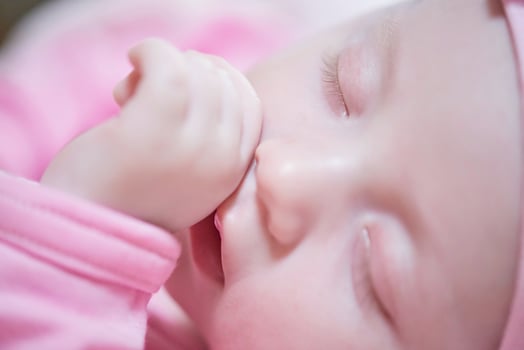 newborn baby sleeping  at home in bed photo
