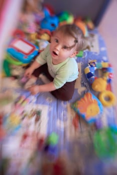 cute  little  baby playing in mobile  bed photo