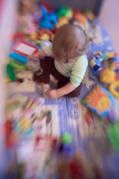 cute  little  baby playing in mobile  bed photo