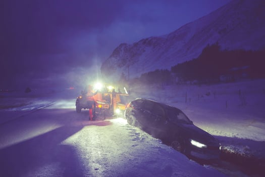 Car being towed after accident in snow storm photo