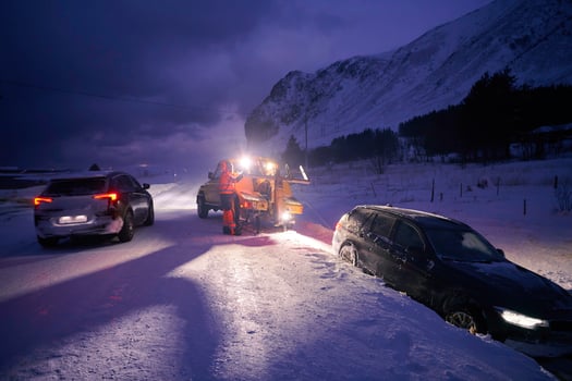 Car being towed after accident in snow storm photo