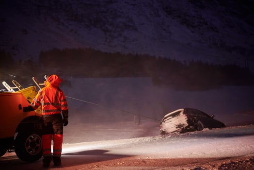 Car being towed after accident in snow storm photo