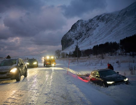 Car being towed after accident in snow storm photo