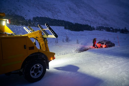 Car being towed after accident in snow storm photo