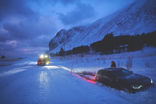 Car being towed after accident in snow storm photo