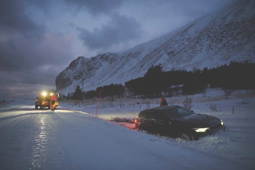 Car being towed after accident in snow storm photo