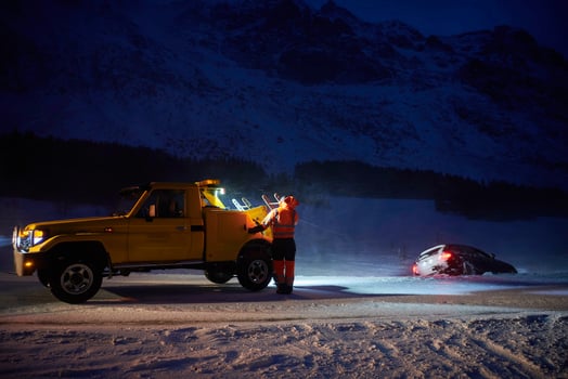 Car being towed after accident in snow storm photo