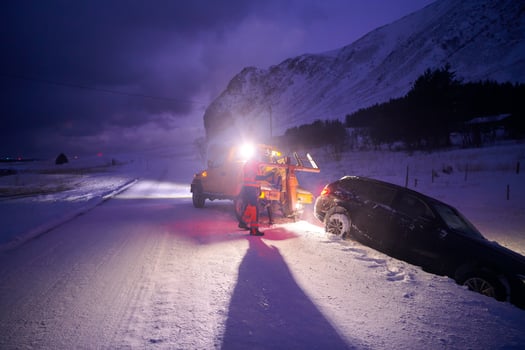 Car being towed after accident in snow storm photo