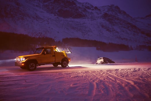 Car being towed after accident in snow storm photo