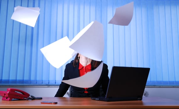 Happy businesswoman throwing documents photo