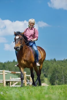 happy woman  on  horse photo